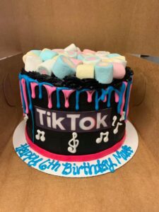 Pink and blue drip Tiktok cake starting at $31.99 (feeds 12-16)