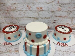 Cat and the Hat tiered first birthday starting at $69.99 (feeds 30) smash cakes starting at $8.99 per