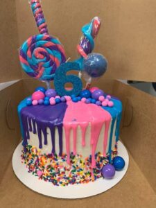 Pink blue purple candy cake starting at $26.99 (feeds 12-16)