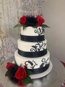 Three tiered black and red cake starting at $175 (feeds 70-80