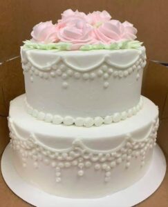 Pink flower draping cake staring at $59.99 (feeds 30)