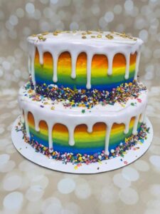 Rainbow stripe tiered drip cake starting at $79.99 (feeds 30)