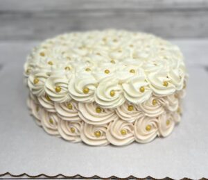 White rosette gold dragee cake starting at $26.99 (feeds 12-16)
